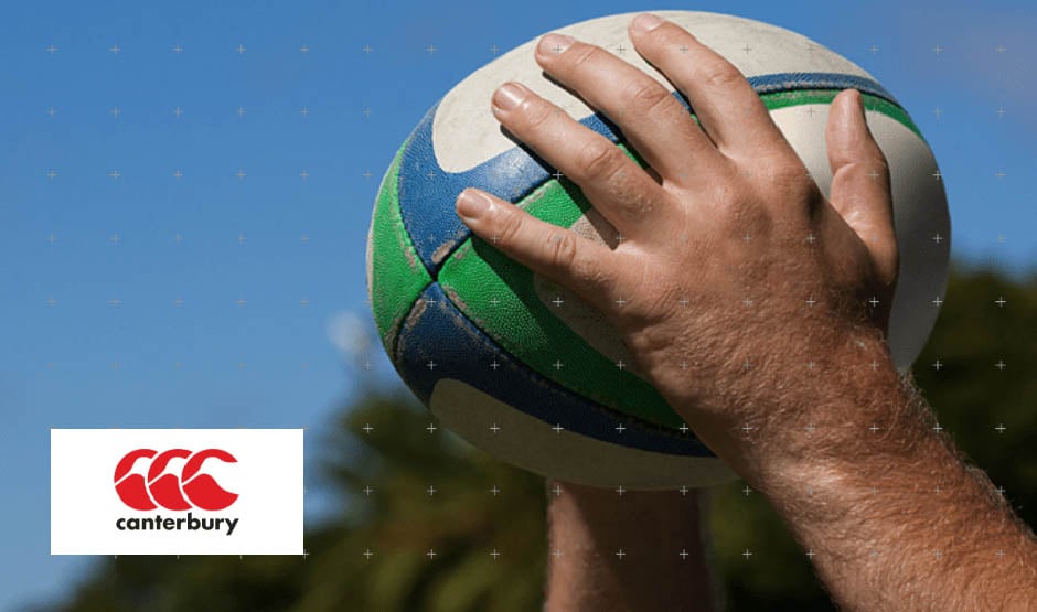 Person holding rugby ball with both hands