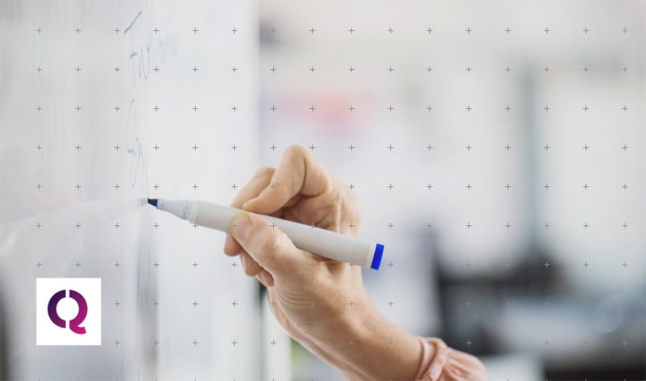 Person writing on a whiteboard