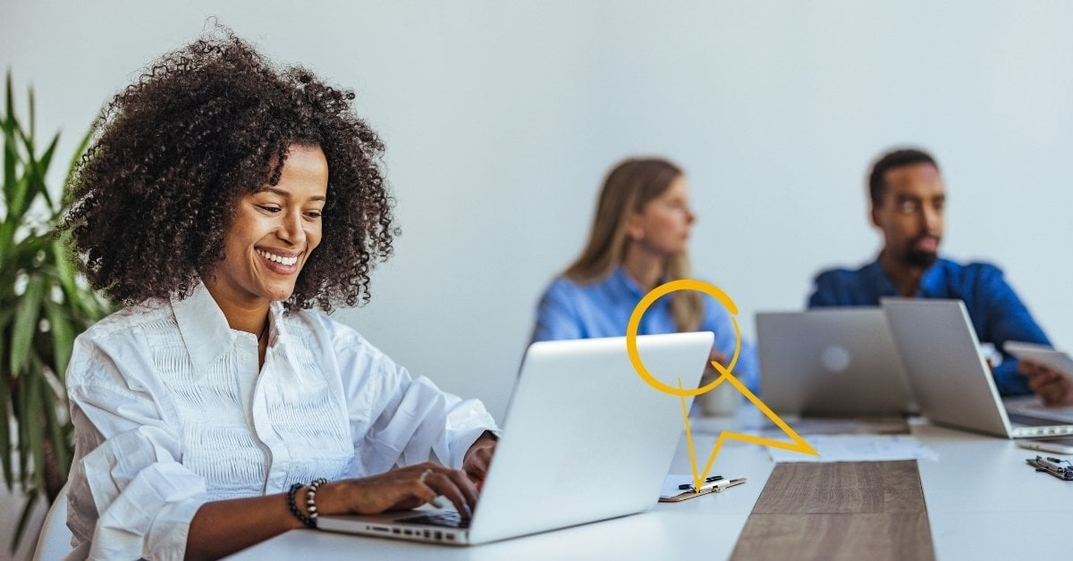 A woman smiles as she works at a laptop. A yellow winner ribbon is overlaid.