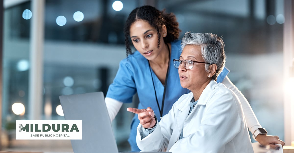Two doctors looking at a laptop