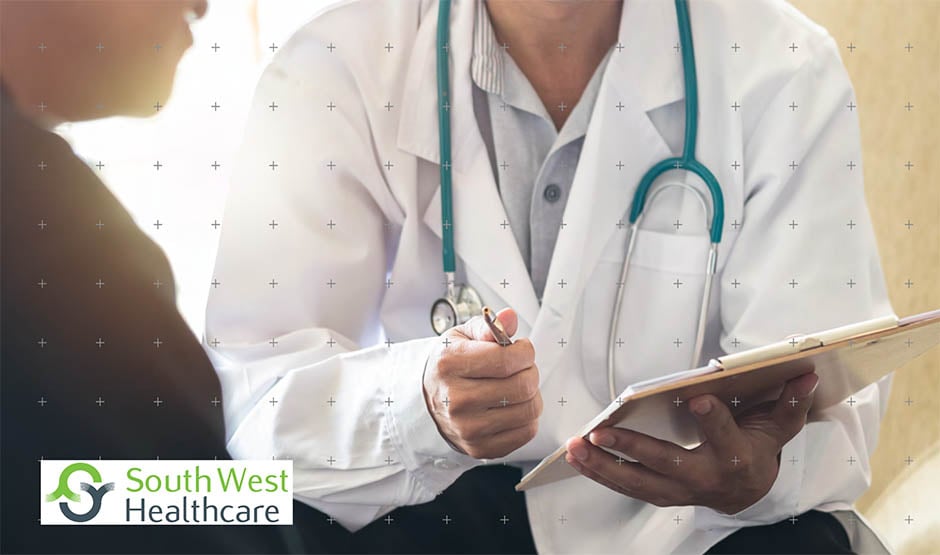 Doctor looking at a tablet with South West Healthcare logo