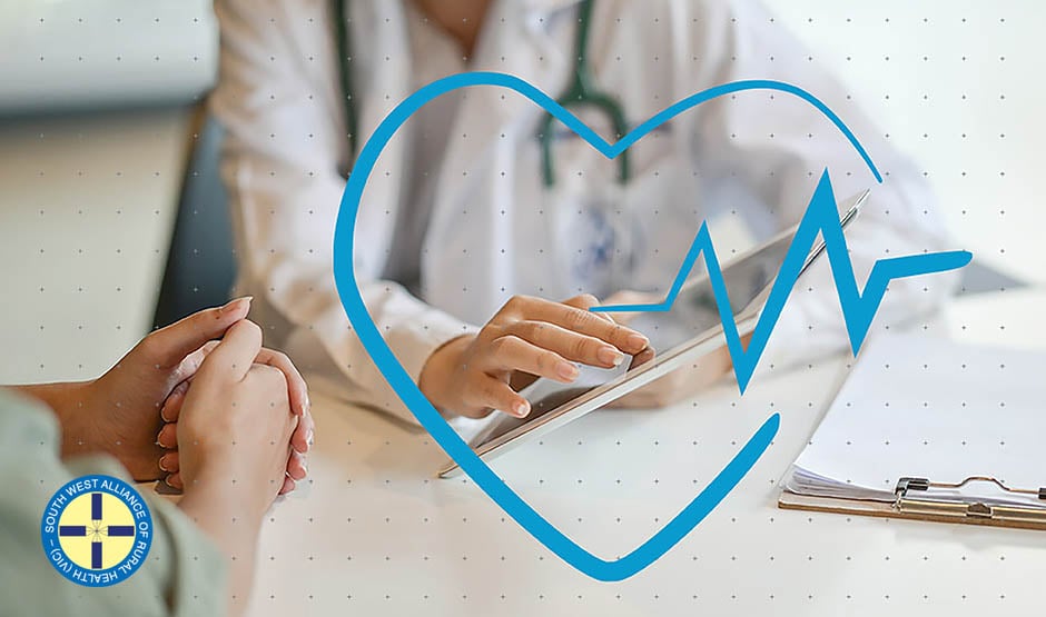 Doctor showing something on the ipad to patient